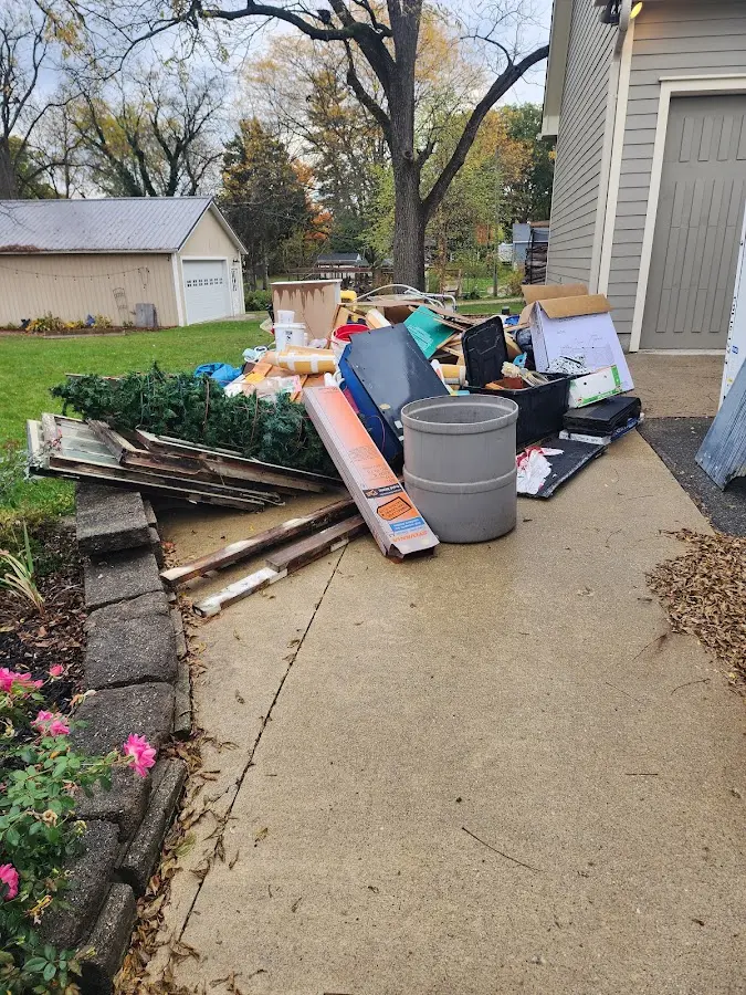 Dumpster being loaded with debris for 3 Yard Dumpster Rental in Frankfort